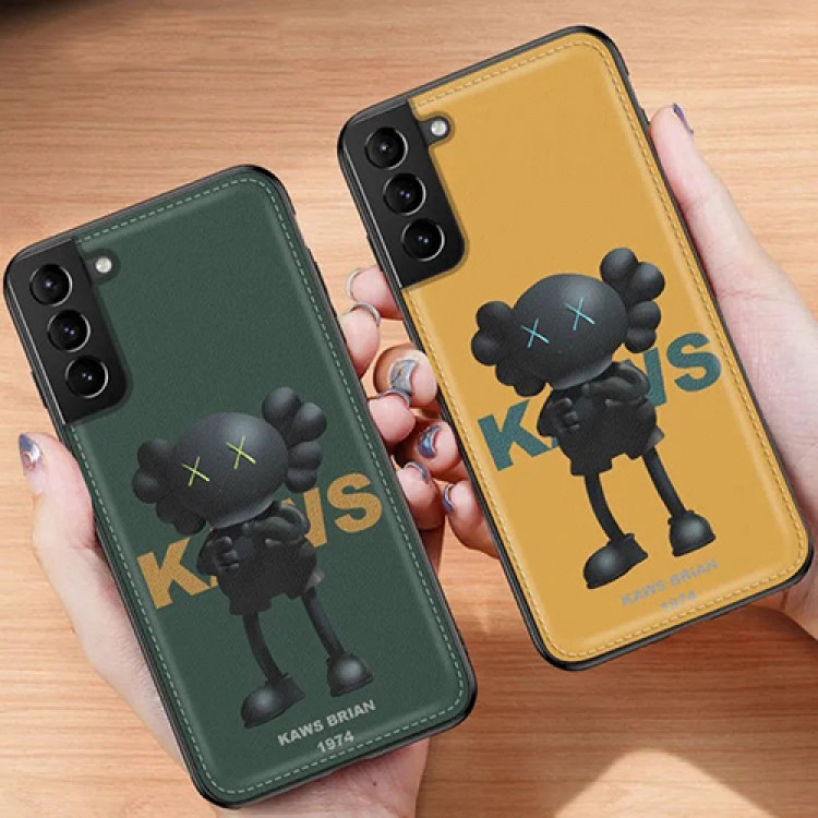 カウズ 人気ブランド iphone14/13 pro/12 pro max/11 pro maxスマホケース KAWS レザー Galaxy S22/S21+/S21 ultra/s20/s20+/s20 ultra/s10/note20ケース シンプル kaws brian 韓国風 アイフォン12 mini/11/x/xs/xr/8/7/se2カバー 2021 衝撃吸收 高級 メンズ レディース