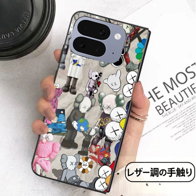 Kaws カウズアイフォン ultra fold 2026ブランドケースメンズブランドギャラクシーz flip 8 7 6 4 5 fold6 5 4 3 7 8スマホカバースムーズ高級感 Google Pixel Pro 11 10 9 foldケースハイブランドハイブランドGalaxy z flip 5 4 3 6 7 8携帯ケースビジネス