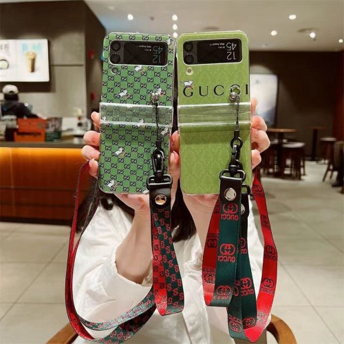 グッチ GALAXY Z FLIP 4スマホケース 定番GG柄 ブランド Gucci ギャラクシー Z Flip3スマホカバー 腕と首ストラップ付き 落下防止 Galaxy z flipケース かわいい 猫ちゃん柄 オシャレ メンズ 女の子愛用