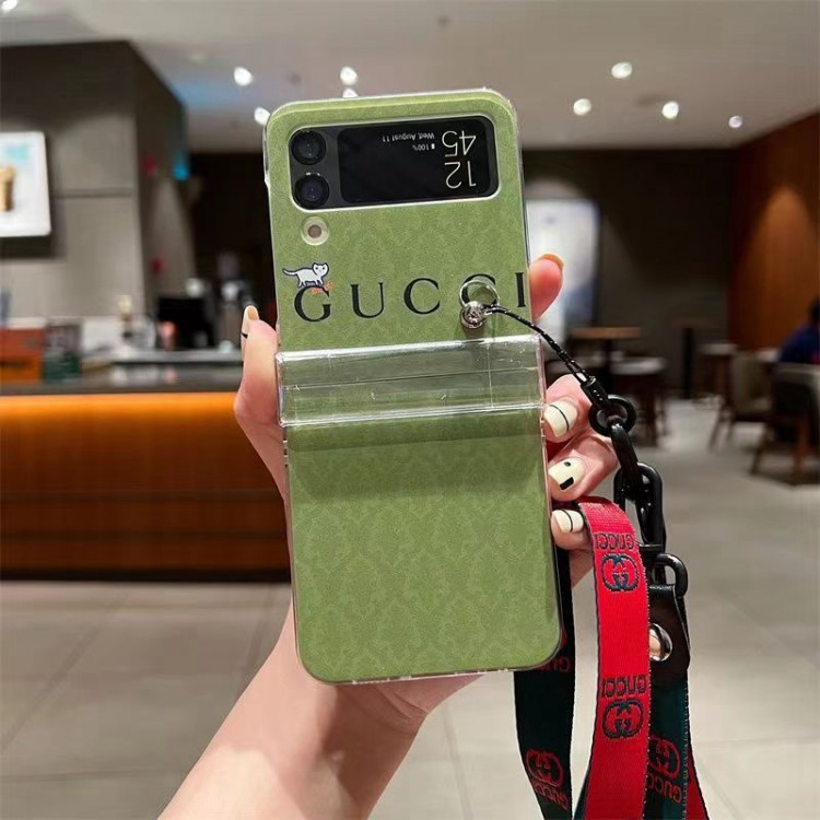 グッチ GALAXY Z FLIP 4スマホケース 定番GG柄 ブランド Gucci ギャラクシー Z Flip3スマホカバー 腕と首ストラップ付き 落下防止 Galaxy z flipケース かわいい 猫ちゃん柄 オシャレ メンズ 女の子愛用