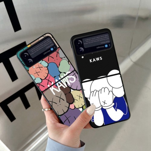 Kaws ブランド Galaxy Z Flip4 5Gケース 個性 漫画の柄 カウズ サムスンGALAXY  Z FLIP4携帯カバー 男女兼用 Galaxy Z Flip4カバー PU&TPU 2重構造 おしゃれ カッコいい 衝撃に強い 便利 実用ケース